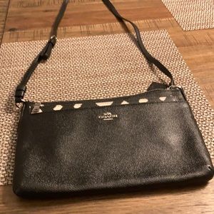 NWOT coach cross body bag has an insert bag that’s goes with it